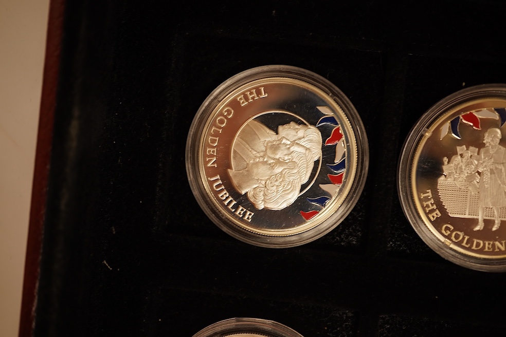 Yorkshire Mint 'Royal Arms Collection' of 12 enamelled silver armorial shields, cased and Westminster Mint 12 QEII Falkland Islands Golden Jubilee proof silver coins, cased (2 cases)